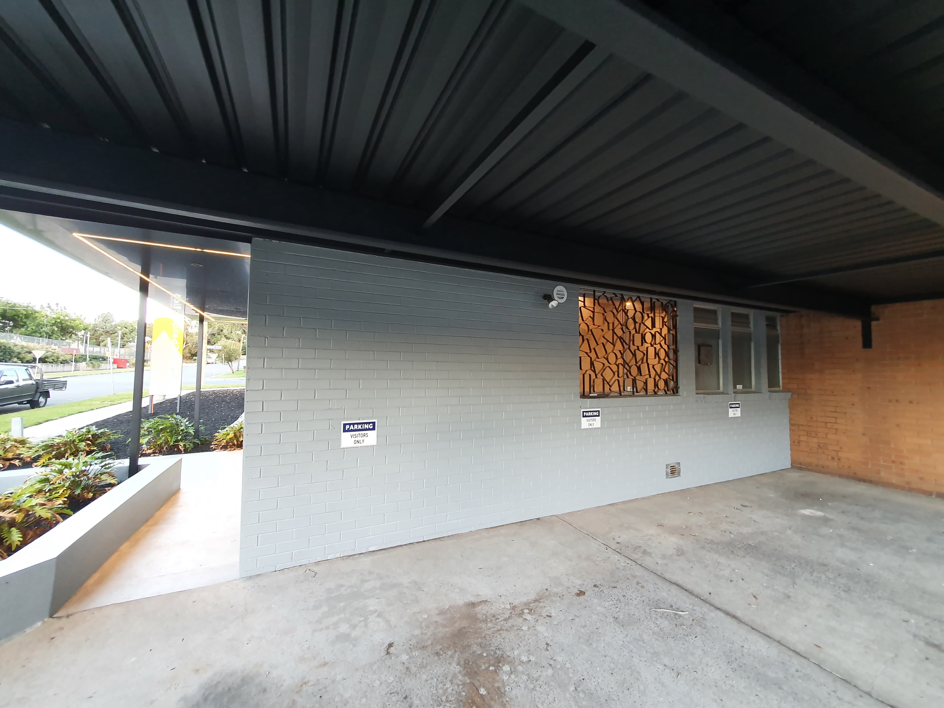 Silverwater commercial under awning and brick wall after repainting